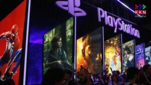 People stand online next to the PlayStation booth at the Electronic Entertainment Expo E3 at the Los Angeles Convention Center.